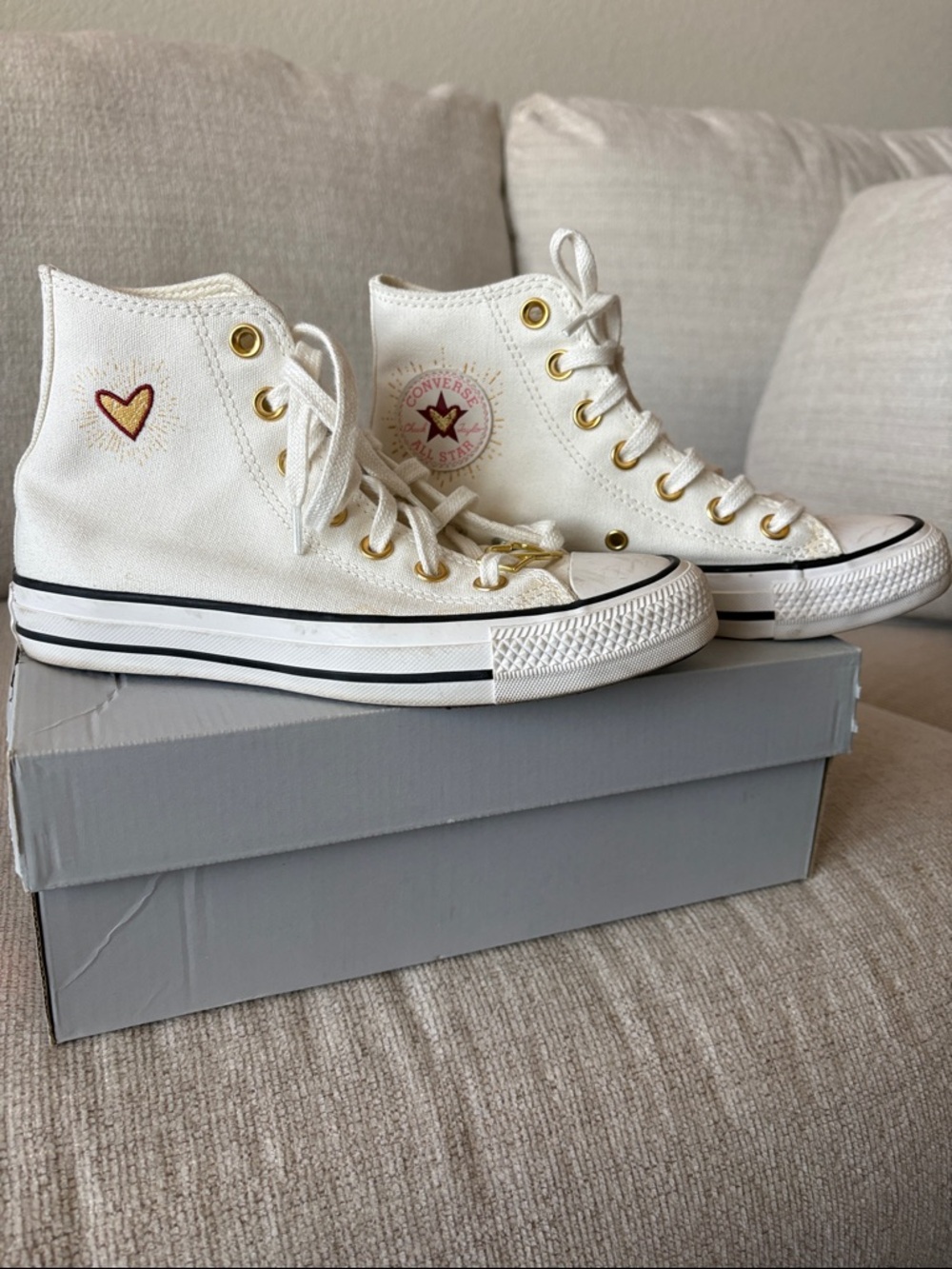 Converse White High-Top Sneakers with Gold Eyelets and Pink Logo